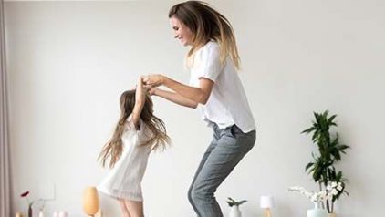 Mom And Daughter Jumping